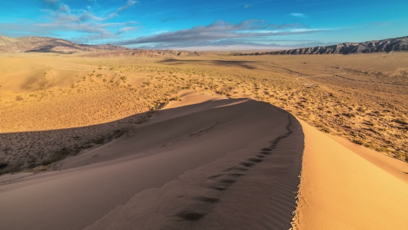 Human Footprints On The Crest Of a Sand Dune In The National Park Altyn Emel.   - September 2016