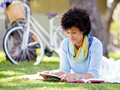 Young woman using tablet in the park. - PhotoDune Item for Sale