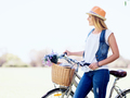 Happy young woman with bicycle - PhotoDune Item for Sale