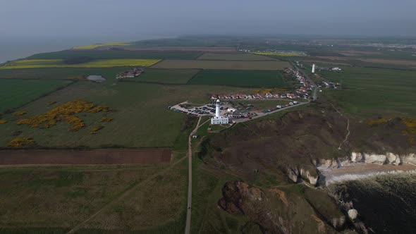 Aerial Panorama Of Flamborough Village And The Lighthouse In The East Riding of Yorkshire, England.