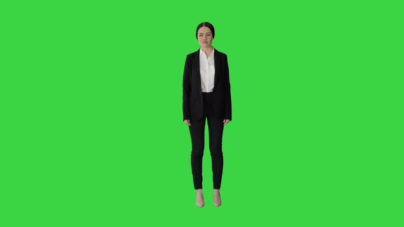 Attractive Businesswoman Standing Doing Nothing on a Green Screen, Chroma Key.