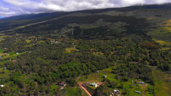 Beautiful 4k drone Maui upcountry on near Keokea looking towards Haleakala Mountain. February sky.