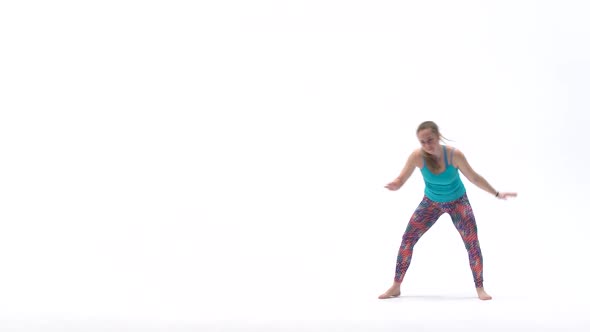 Energetic Girls Are Practicing Capoeira in White Background of Studio. Afro-Brazilian Martial Art