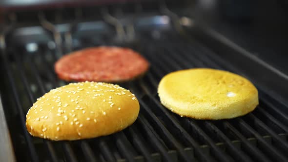 Top view of the delicious burger cutlet and fresh buns grilled on barbeque