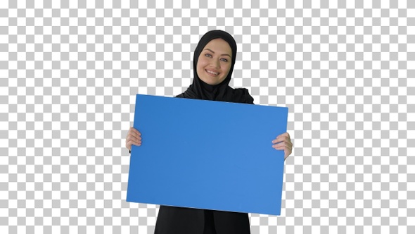 Smiling Arab woman in hijab holding blank, Alpha Channel