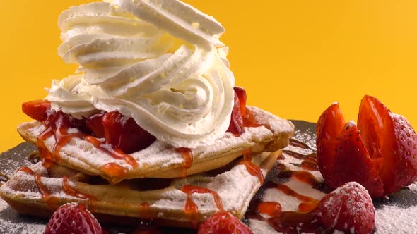 Belgian waffles with strawberry, sweet strawberry topping, whipped cream and powdered sugar 