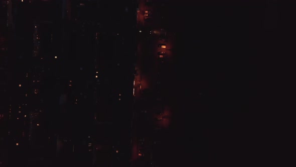 Aerial Birds Eye Overhead Top Down View of Dimly Lit Street with Parked Cars