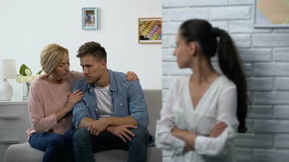 Offended Woman Secretly Watching Mother-In-Law Consoling Husband After Quarrel