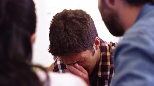 Businessman crying in office