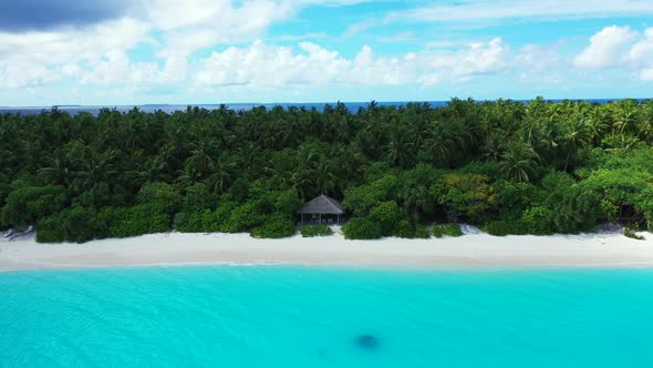 Tropical drone abstract shot of a white paradise beach and blue water background in vibrant 4K