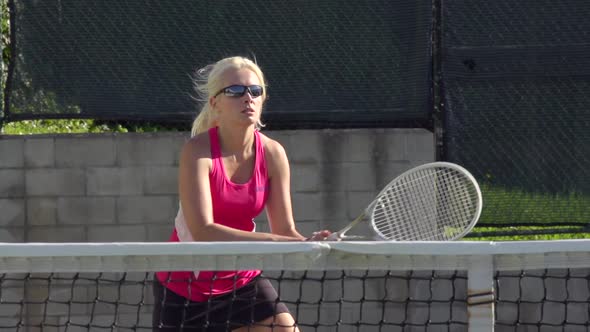 Women playing tennis.