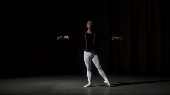 Male Dancer Performs On High Lighted Stage