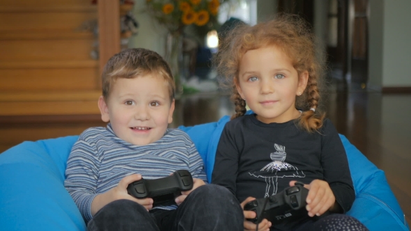Cute Boy And Girl Playing a Videogame