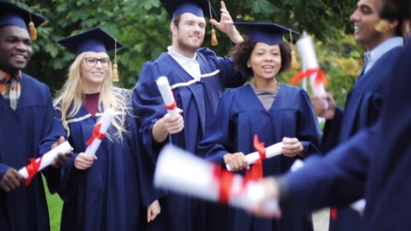 Happy Students In Mortar Boards With Diplomas 4