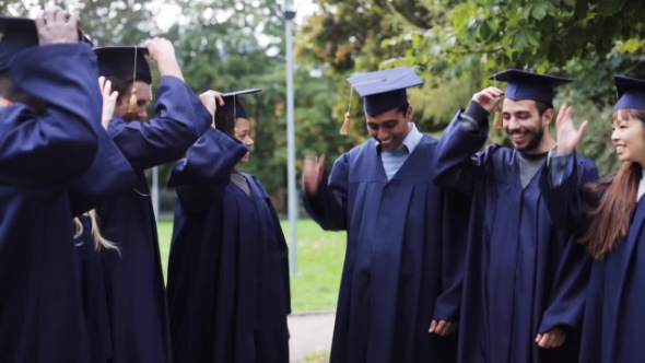 Happy Students Throwing Mortar Boards Up 39