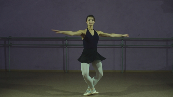 Beautiful Graceful Ballerine In Black Practice Arabesque Ballet Position In Hall