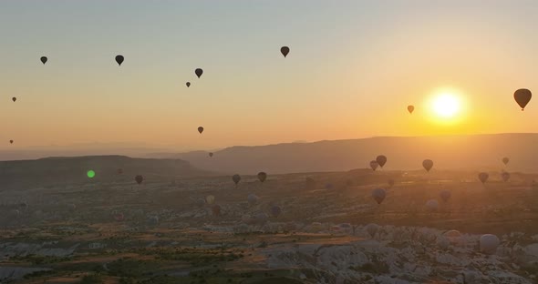 Aerial Cinematic Drone View of Colorful Hot Air Balloon Flying Over Cappadocia