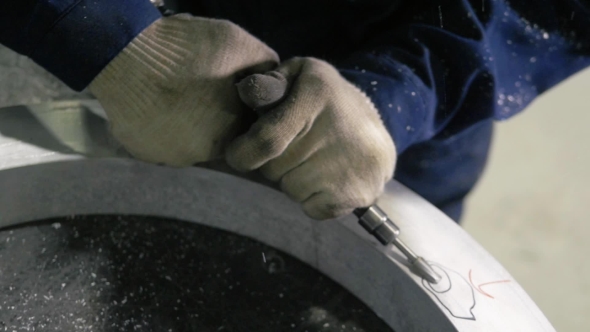 Industrial Engineer Working On Cutting a Metal And Steel Bar With Angle Grinder, Metallurgic Factory