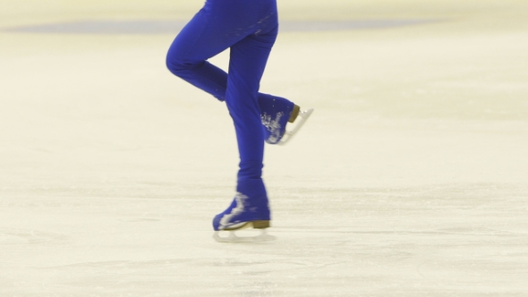 Slender Legs Of Girl Skater. Competitions In Figure Skating, Performance Of Young Athletes