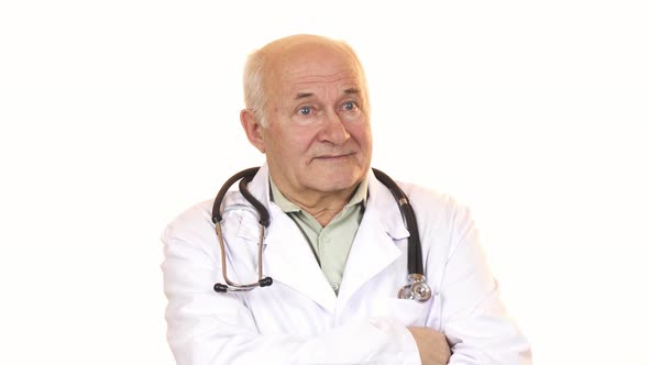 Senior Male Doctor with a Stethoscope Smiling To the Camera