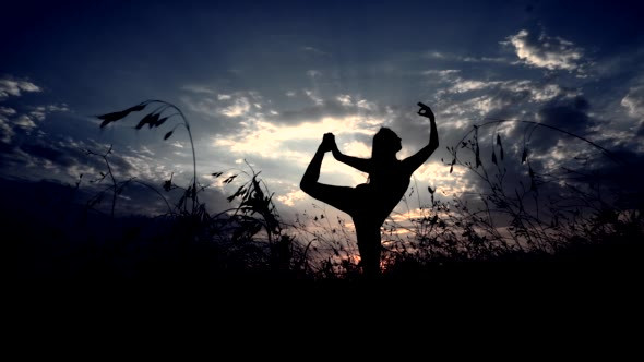 Silhouette Against Sunset of One Young Graceful