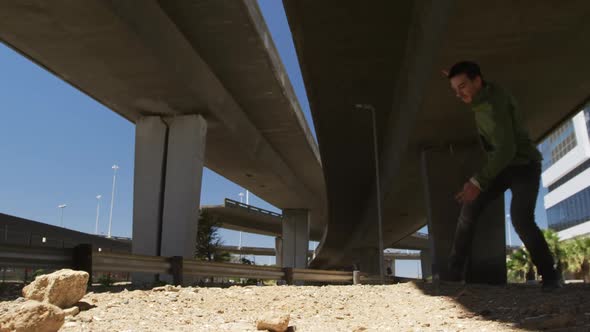 Caucasian man practicing parkour