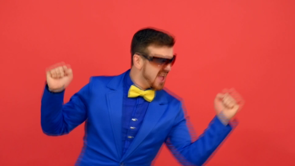 Fashionable Man Dancing On Red Background