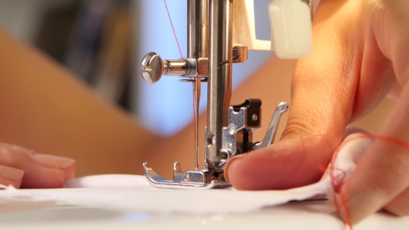Sewing Machine, The Needle Pierces The Fabric.