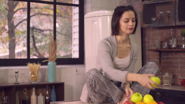 Brunette Dieting Eats Fruits At Home