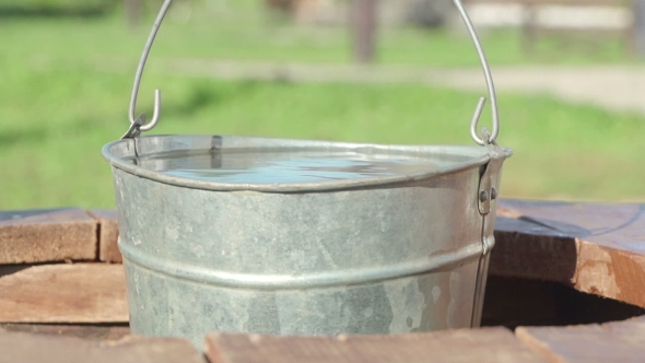 Concepts And Ideas Preservation Of Environment. Well. Bucket Of Clean Water