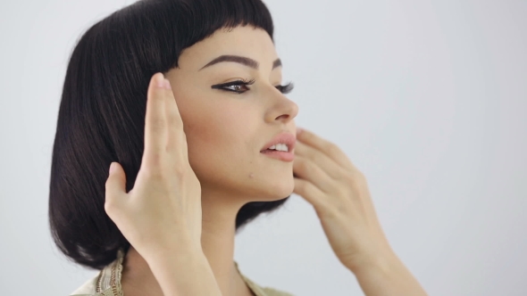 Hairstyle Preparations. Cleopatra's Make-up And Haircut Posing In Studio