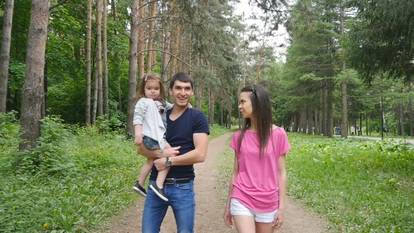 Happy Family On The Walk In Forest