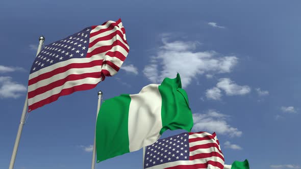 Flags of Nigeria and the USA Against Blue Sky