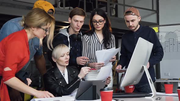 Multi Ethnic Group of Young Hipster People Discussing Business Ideas