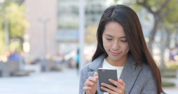 Business woman use of cellphone at outdoor