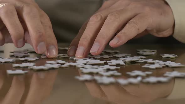 Aged Man Trying to Combine Puzzle, Rehabilitation, Thought Process Support