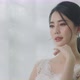 Slow Motion Beautiful Young Asian Bride Fitting Wedding Dress Front Of The Mirror. Bridal concept. - VideoHive Item for Sale
