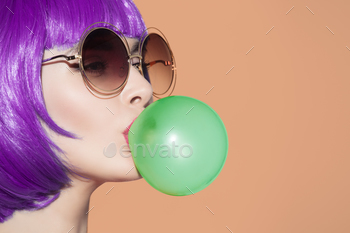 Green Bubble Chewing Gum. Orange Background.
