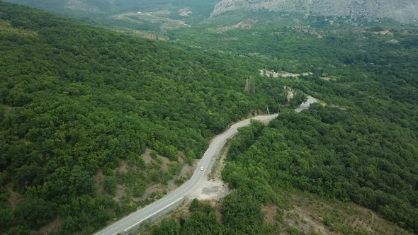 A Winding Road Through the Crimean Mountains Along the Sea