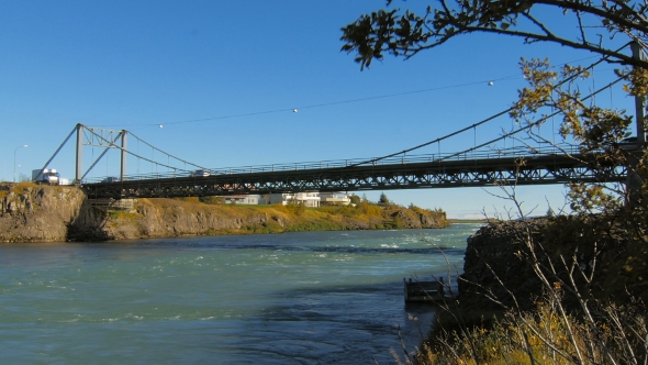 Cars And Trucks Move On Olfusarbru Bridge Over Olfusa River In Selfoss City Iceland