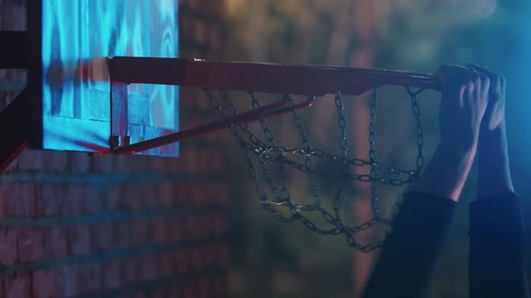 Basketball Ball Getting in the Hoop on Outdoor Playground at Night - Slam Dunk