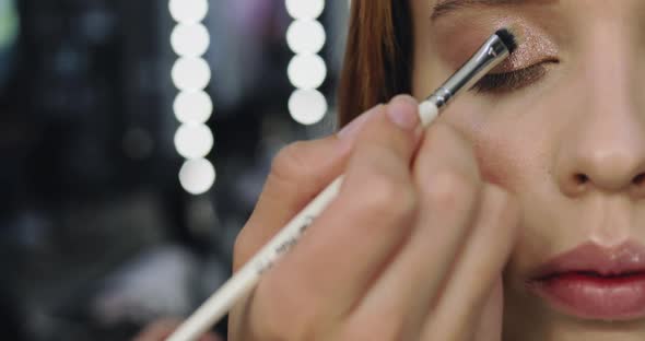 Closeup of Perfect Nude Makeup Process for Young Female Model