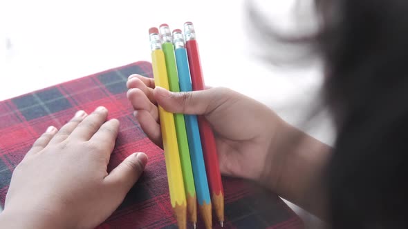 Child Girl Holding Many Color Pencils