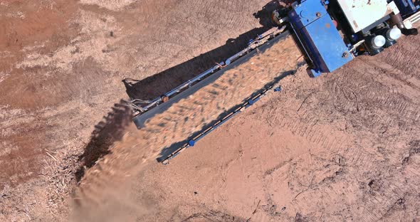 Closeup Conveyor of an Industrial Wood Shredder Producing Wood Chips From Roots