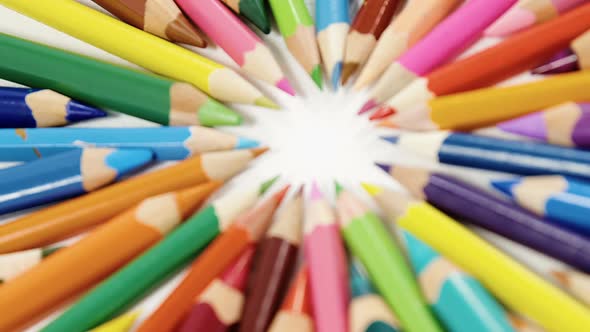 Close-up of colored pencils arranged in a circle