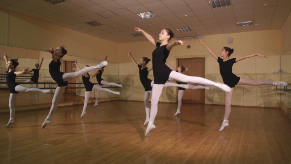 Group Of Ballet Dancers Jumping In The Air