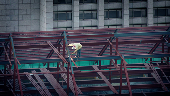 Man Soldering Beams Of New Building