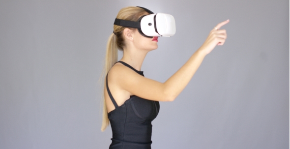Beautiful Sexy Blond Girl Enjoys Virtual Reality Glasses