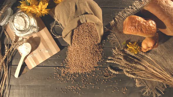 Still life with Bread, Wheat, Flour and Flowers.