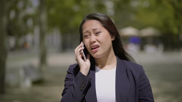 Attractive Girl Talking By Cell Phone Outdoor